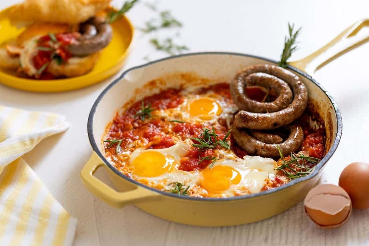 Heritage Month delicacies: Vetkoek with boerewors and tomato smoor fried eggs