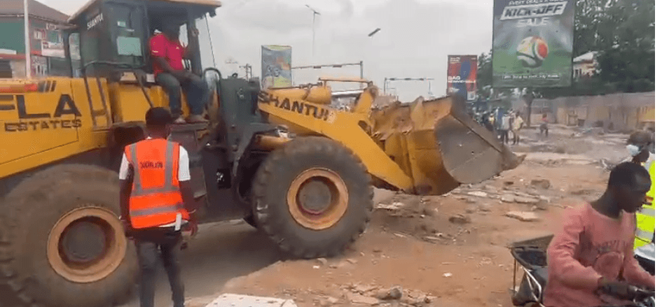 Excavator deployed to clear debris at Ashaley Botwe-School Junction after clean-up exercise