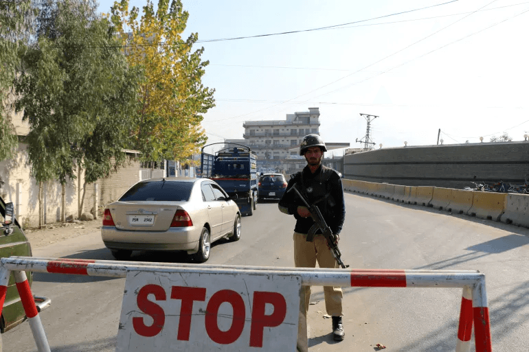 Suspected suicide bombing at police station kills at least 14 in Pakistan, officials say