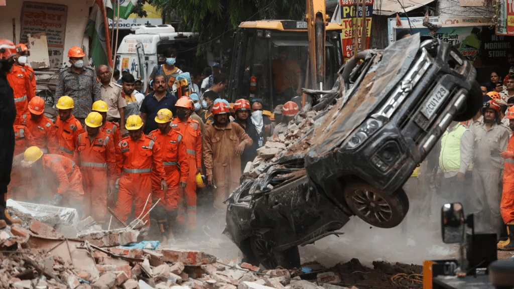 Rescuers dig through debris as seven dead in building collapse in Delhi