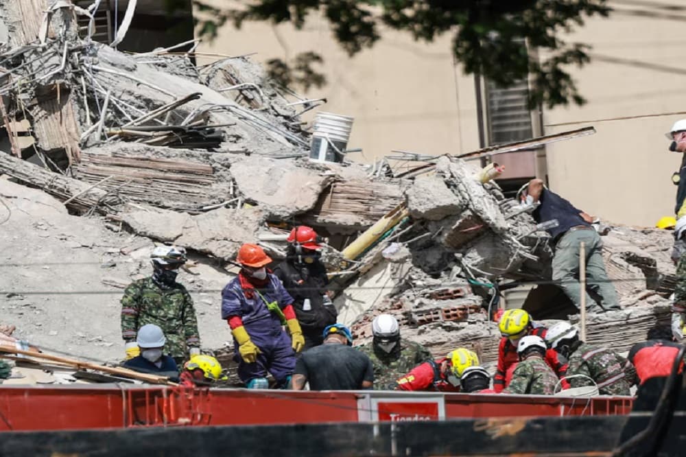 Race to reach trapped survivor offers hope in Colombia quake zone