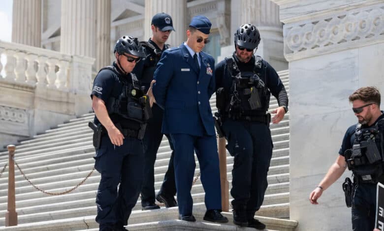 Trump criticism leads to rare criminal charges for Air Force officer who called for impeachment