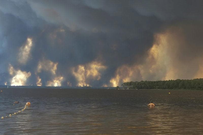 More than 160,000 flee out-of-control wildfires in France, Spain