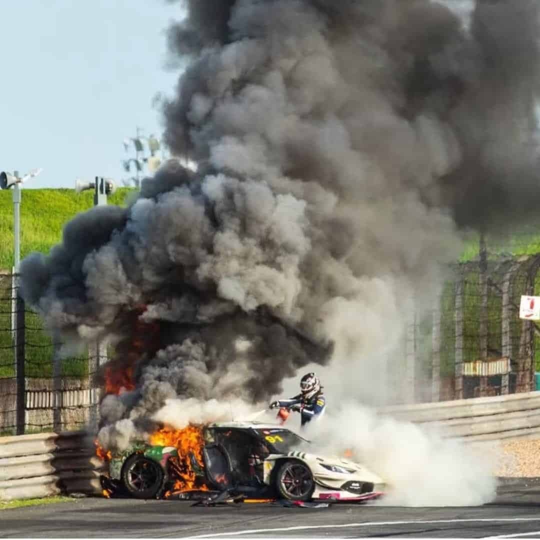 Dicing with death: Racing driver rescues rival from blazing Ferrari wreck