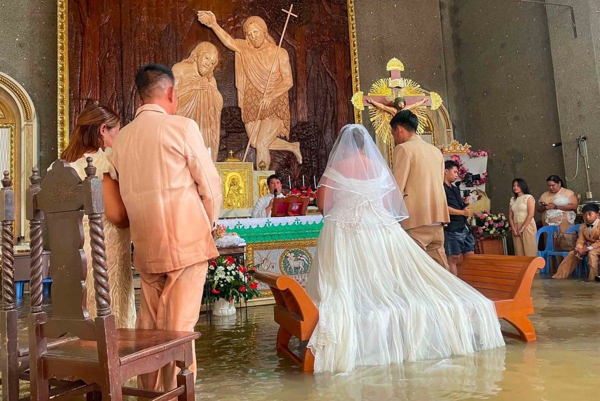 Philippine couple married in hip-deep floodwaters