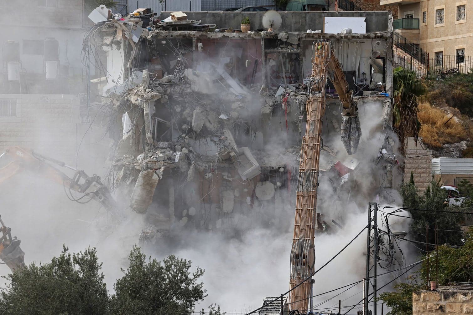 24 hours in pictures: Jerusalem demolition, Thembisa murder case and protests in France and London