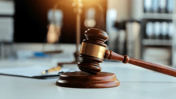 Two accused of land guard activities weep in court