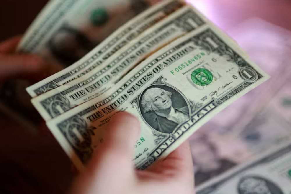 Dollar eases as markets await Fed decision